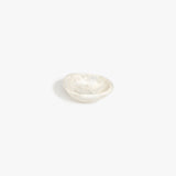 Dinosaur Designs Bones Dish in Chalk Swirl — small handcrafted marbled off-white resin trinket dish with organic form