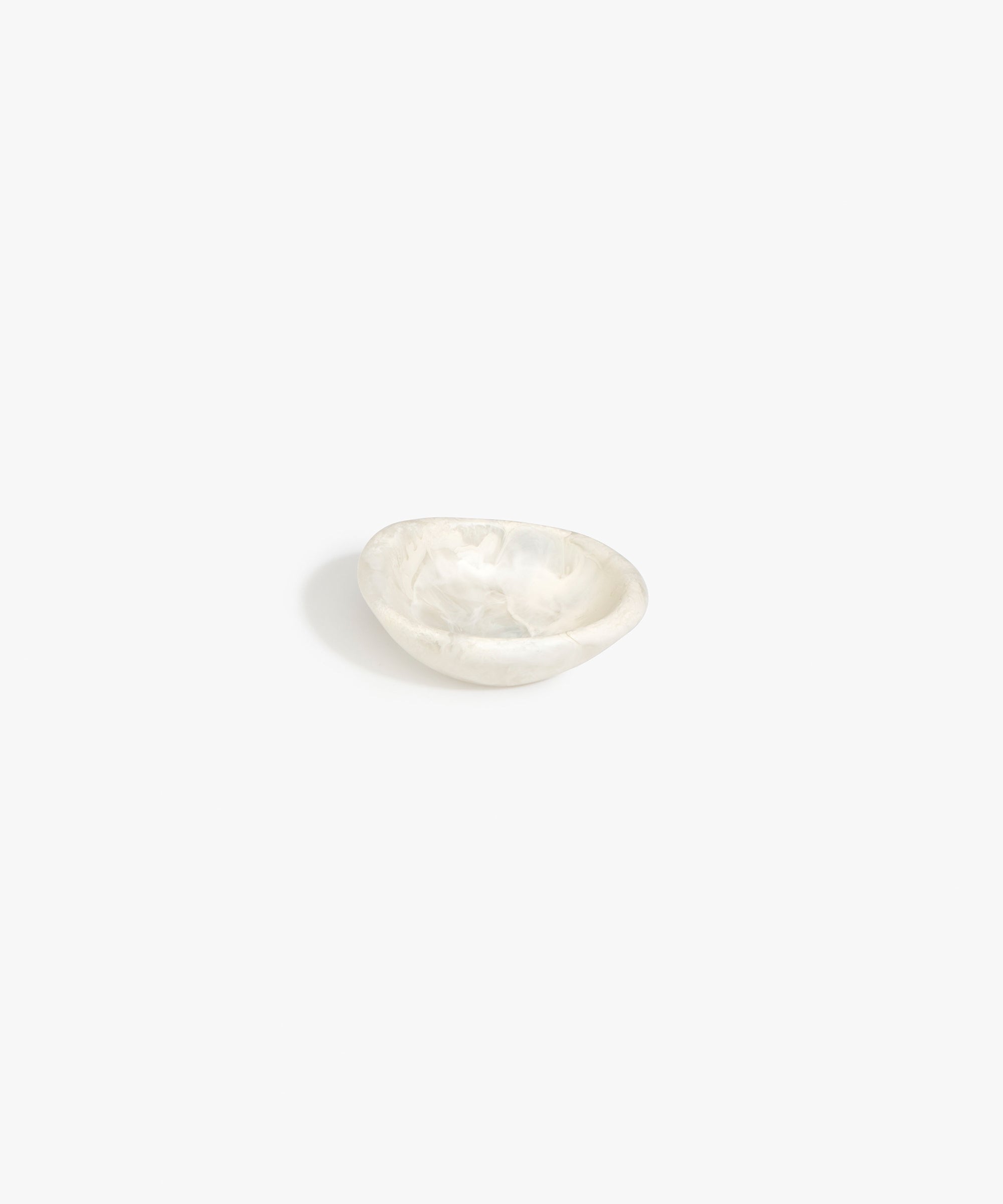 Dinosaur Designs Bones Dish in Chalk Swirl — small handcrafted marbled off-white resin trinket dish with organic form