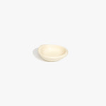 Dinosaur Designs Bones Dish in Cream — small handcrafted resin trinket dish with organic form