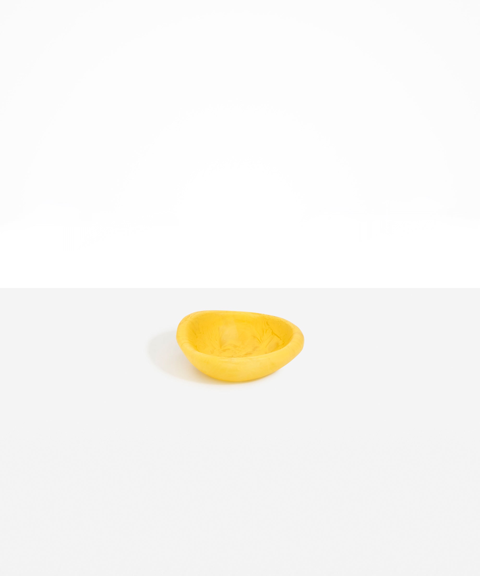 Dinosaur Designs Bones Dish in Pollen — small handcrafted yellow marbled resin trinket dish with organic form..