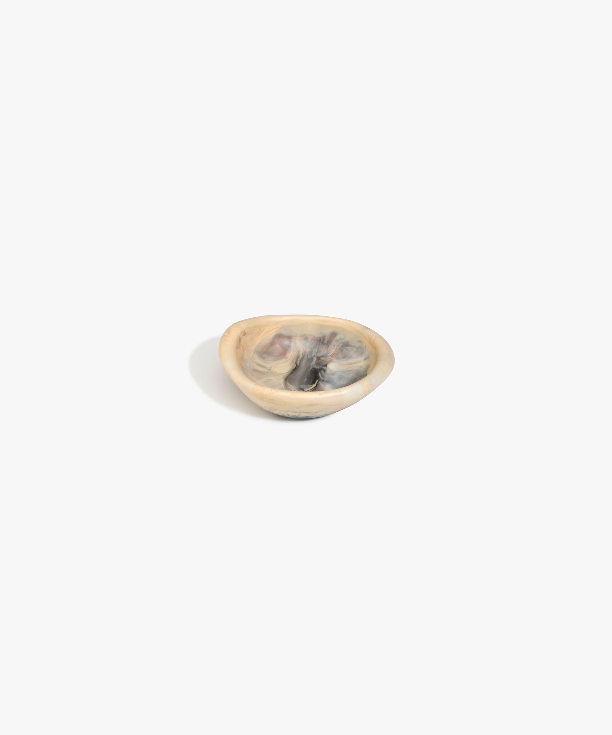 Dinosaur Designs Bones Dish in Sandy Pearl — small handcrafted marbled beige, grey and pearlescent resin trinket dish with organic form
