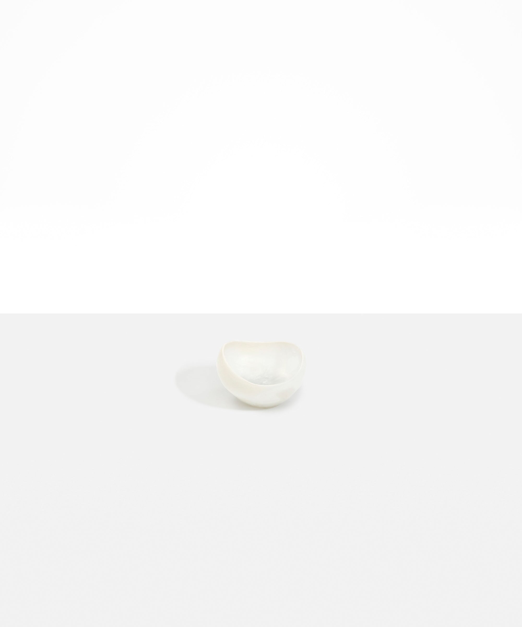 Dinosaur Designs Beetle Dish in Chalk Swirl — handcrafted marbled off-white resin miniature salt dish with rounded organic form