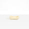 Dinosaur Designs Bones Dish in Cream — handcrafted cream resin trinket dish with pinched bone-shaped organic form