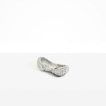 Dinosaur Designs Bones Dish in Granite — handcrafted marbled grey and cream resin trinket dish with pinched bone-shaped organic form.