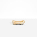 Dinosaur Designs Bones Dish in Sandy Pearl — handcrafted marbled beige and pearlescent resin trinket dish with pinched bone-shaped organic form