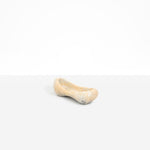 Dinosaur Designs Bones Dish in Sandy Pearl — handcrafted marbled beige and pearlescent resin trinket dish with pinched bone-shaped organic form