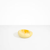 Dinosaur Designs Drift Dish in Daisy— handcrafted marbled light and dark yellow resin chunky trinket dish with organic form