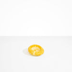Dinosaur Designs Medium Drift Dish in Daisy— handcrafted marbled light and dark yellow resin chunky trinket dish with organic form