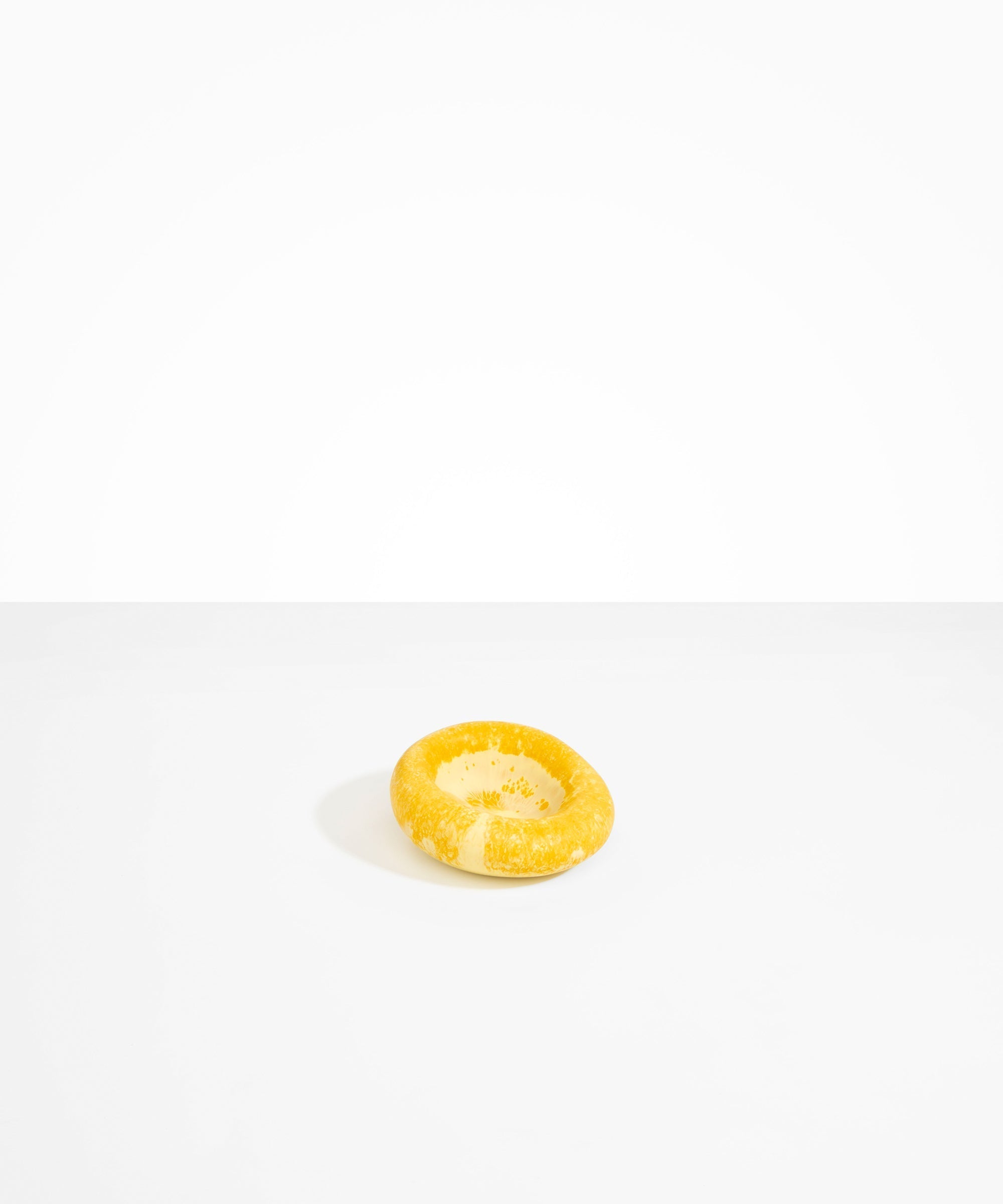 Dinosaur Designs Medium Drift Dish in Daisy— handcrafted marbled light and dark yellow resin chunky trinket dish with organic form
