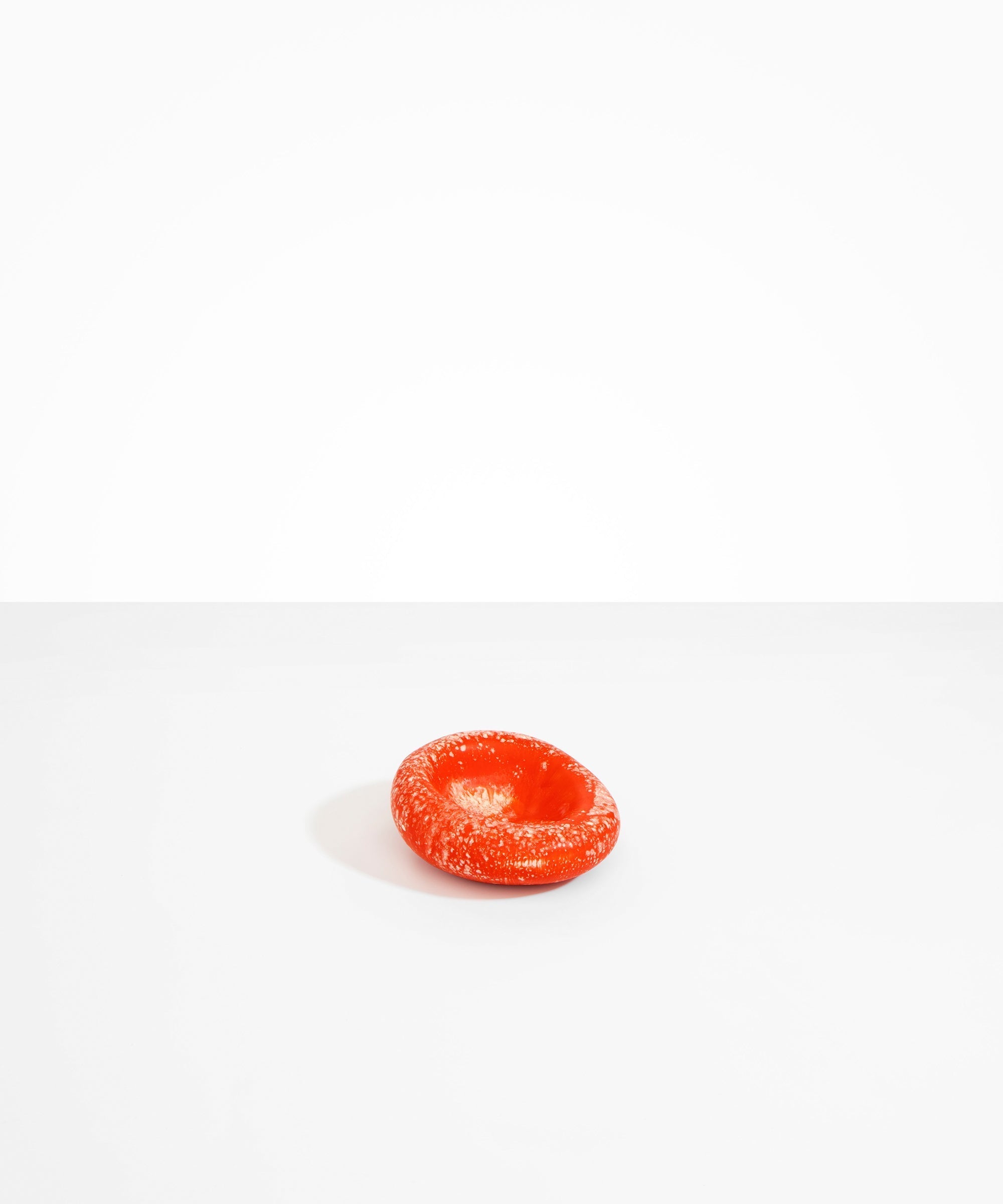 Dinosaur Designs Medium Drift Dish in Strawberry— handcrafted marbled light and dark red resin chunky trinket dish with organic form