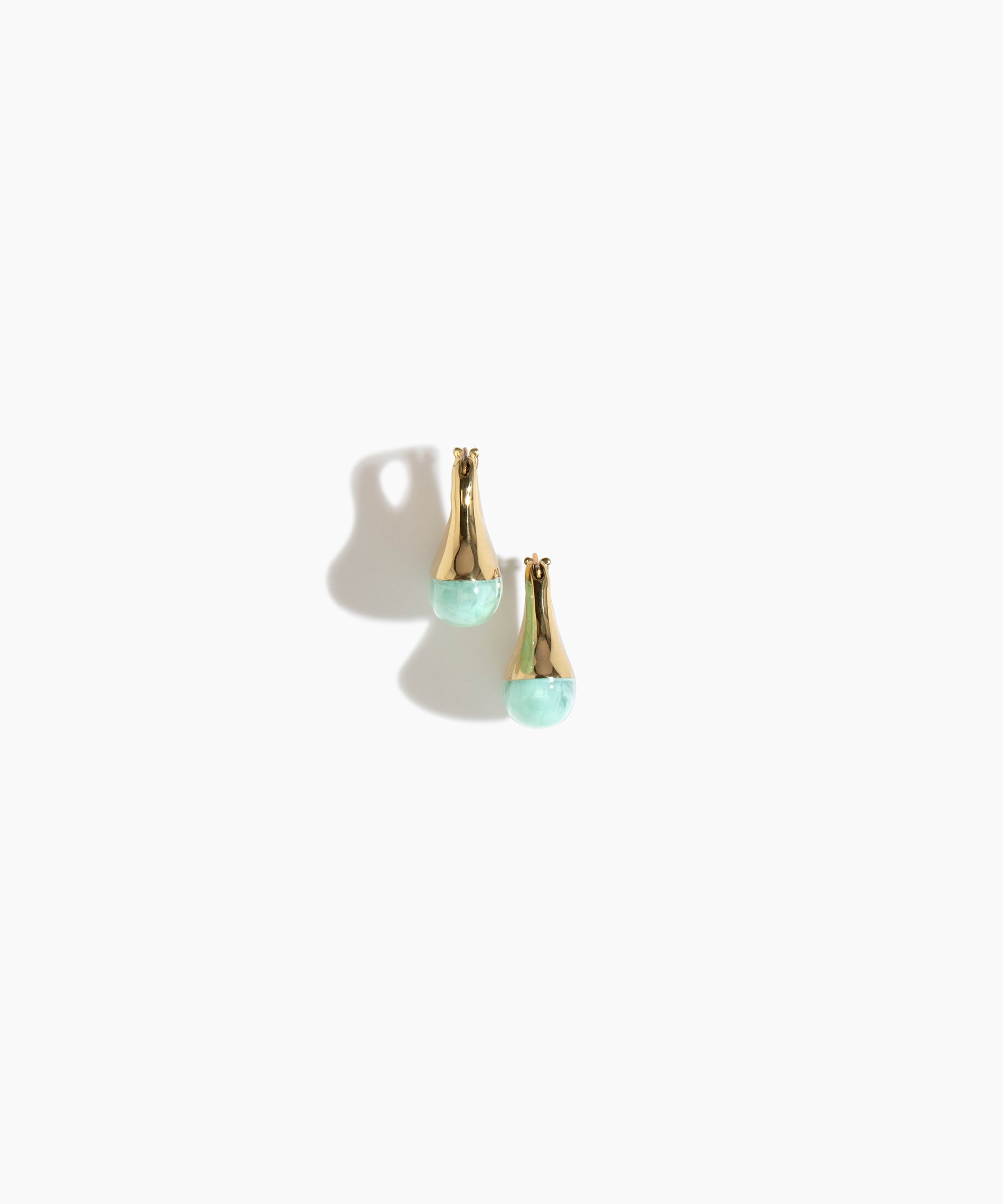 Dinosaur Designs Polished Lotus Hoop Earrings in Mint with Brass — marbled mint blue resin half-dome hoop earrings with polished brass hardware and hinged clasp