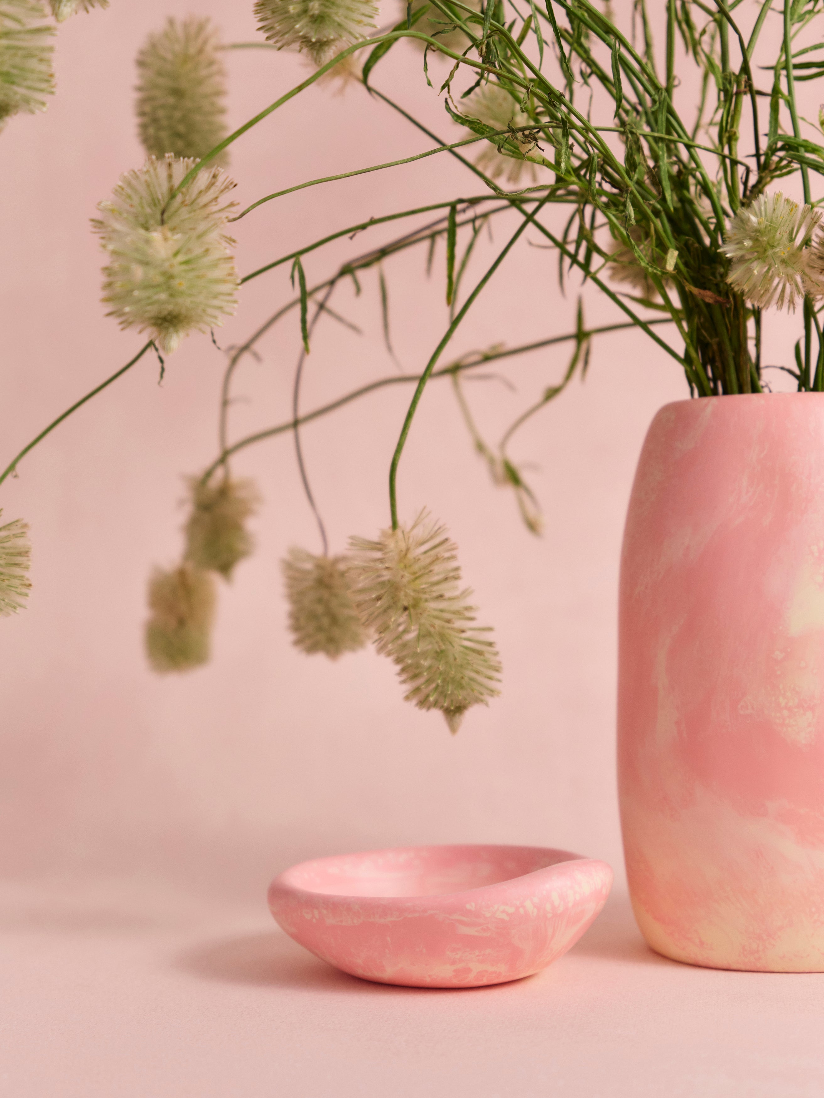 Dinosaur Designs pink and cream coloured resin trinket dish