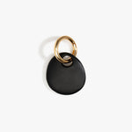 Dinosaur Designs Earth Keyring in Black — handcrafted Black resin pebble bead on a polished brass jump ring