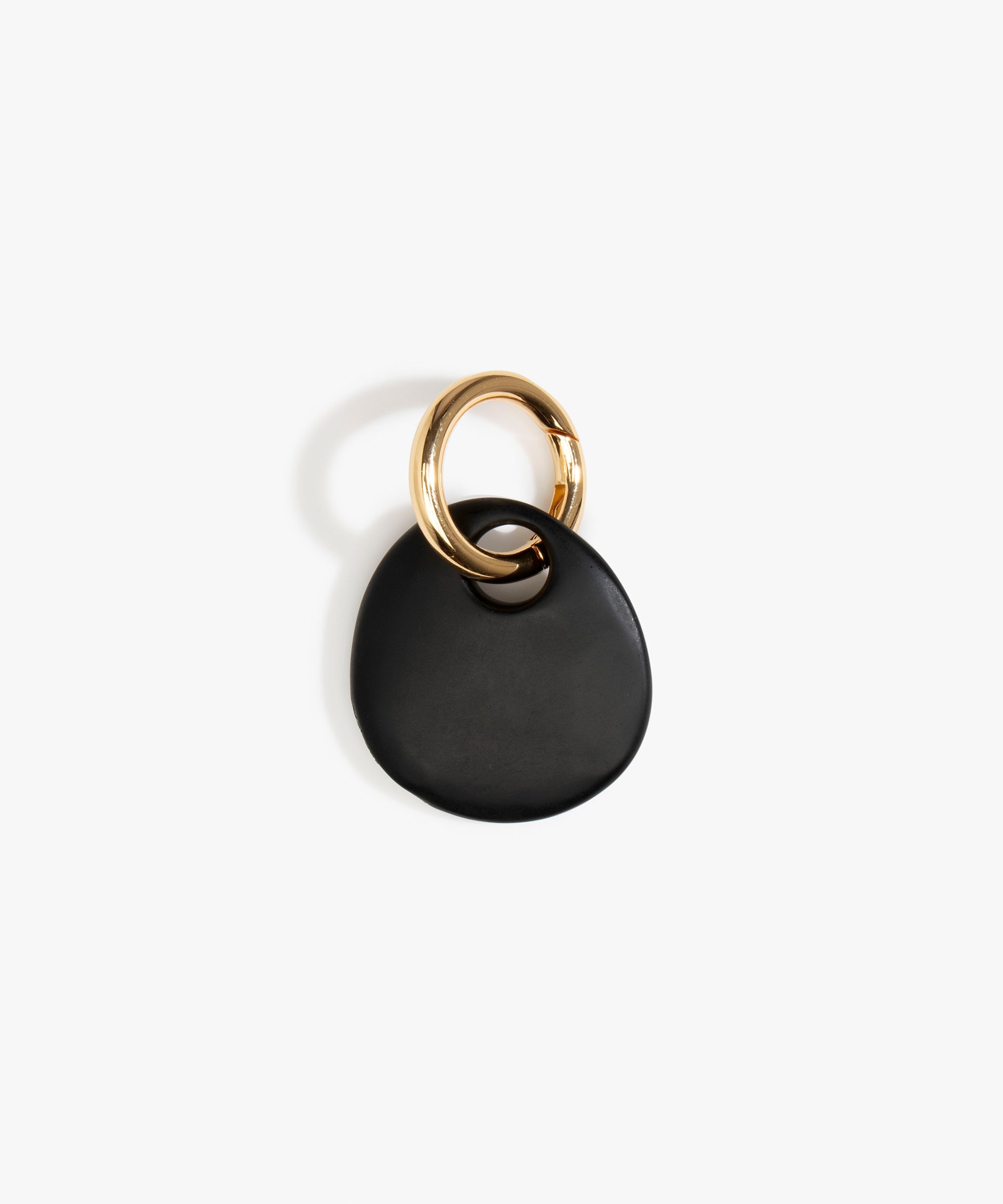 Dinosaur Designs Earth Keyring in Black — handcrafted Black resin pebble bead on a polished brass jump ring
