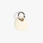 Dinosaur Designs Earth Keyring in Cream — handcrafted Cream resin pebble bead on a polished gunmetal jump ring