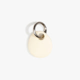 Dinosaur Designs Earth Keyring in Cream — handcrafted Cream resin pebble bead on a polished gunmetal jump ring