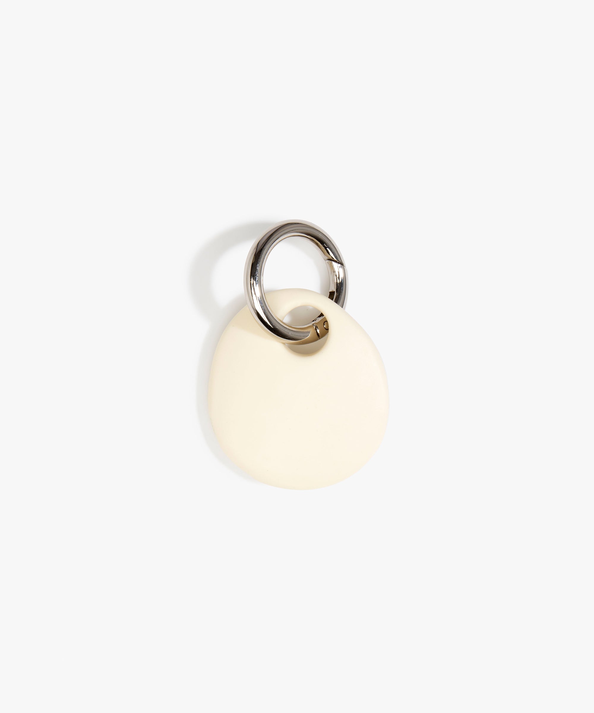Dinosaur Designs Earth Keyring in Cream — handcrafted Cream resin pebble bead on a polished gunmetal jump ring