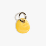 Dinosaur Designs Earth Keyring in Daisy — handcrafted marbled light and dark yellow resin pebble bead on a polished gunmetal jump ring