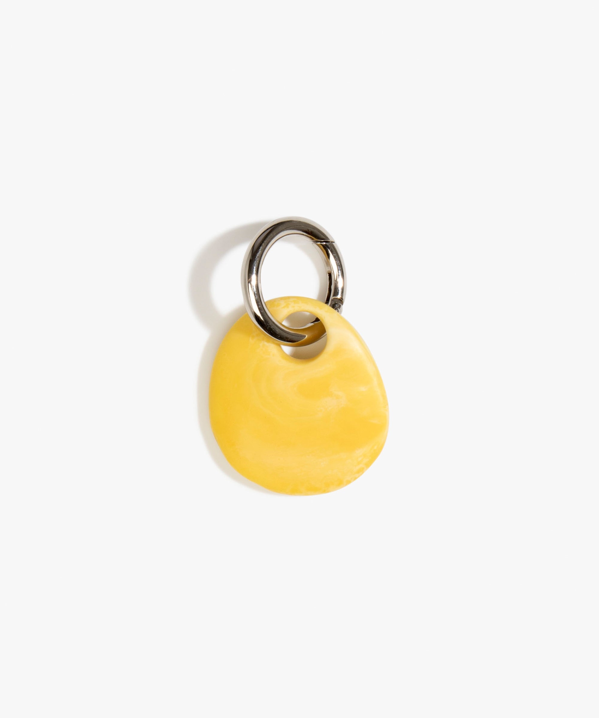 Dinosaur Designs Earth Keyring in Daisy — handcrafted marbled light and dark yellow resin pebble bead on a polished gunmetal jump ring