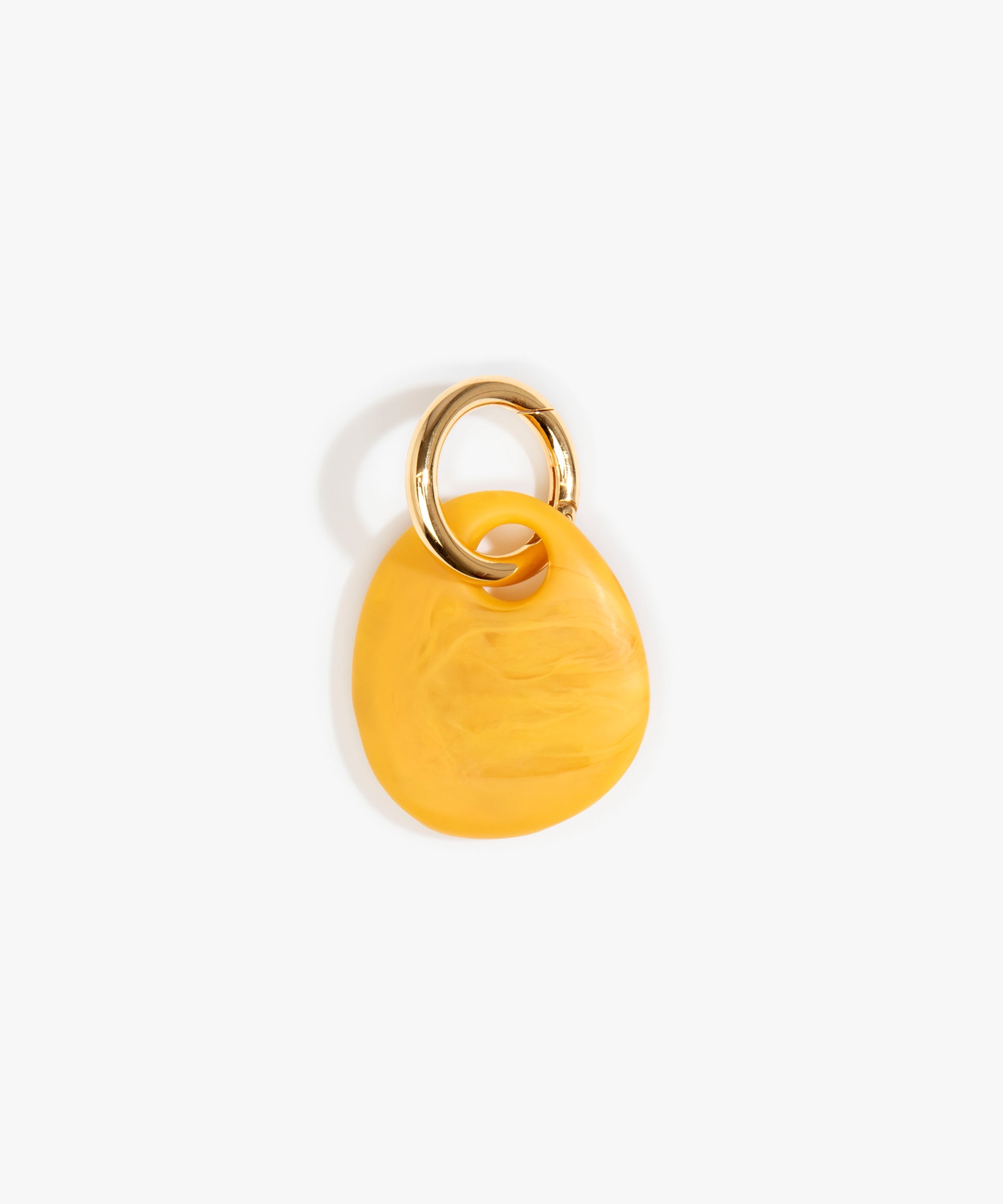 Dinosaur Designs Earth Keyring in Honeycomb — handcrafted marbled mustard yellow resin pebble bead on a polished brass jump ring