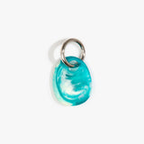 Dinosaur Designs Earth Keyring in Lagoon — handcrafted marbled blue and Cream resin pebble bead on a polished gunmetal jump ring