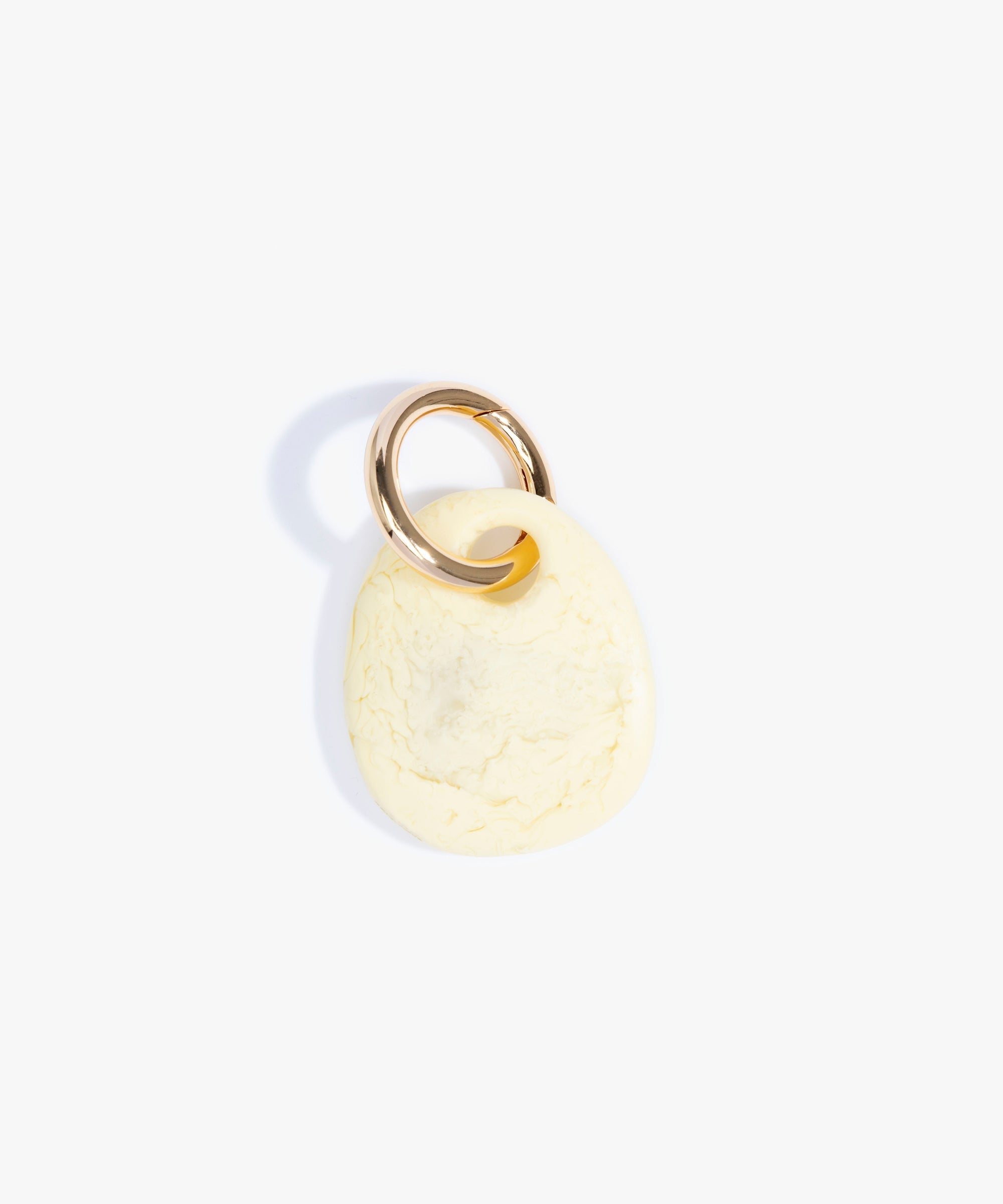 Dinosaur Designs Earth Keyring in Lemon — handcrafted marbled pastel yellow resin pebble bead on a polished brass jump ring
