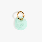 Dinosaur Designs Earth Keyring in Mint— handcrafted marbled green blue resin pebble bead on a polished brass jump ring