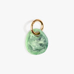 Dinosaur Designs Earth Keyring in Moss — handcrafted marbled green resin pebble bead on a polished brass jump ring