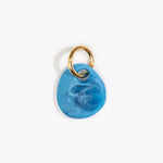 Dinosaur Designs Earth Keyring in Sky — handcrafted marbled blue and clear resin pebble bead on a polished brass jump ring