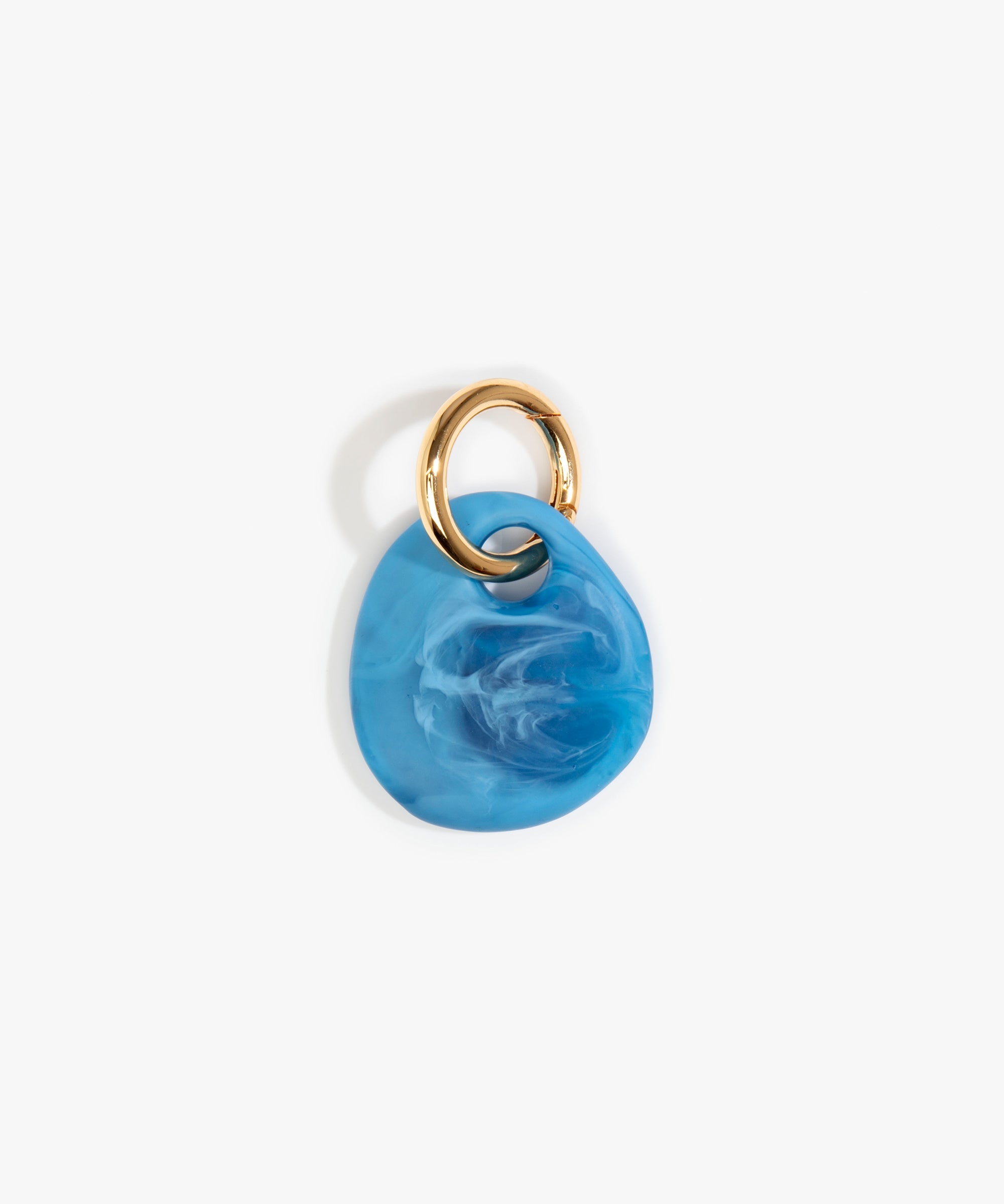 Dinosaur Designs Earth Keyring in Sky — handcrafted marbled blue and clear resin pebble bead on a polished brass jump ring