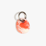Dinosaur Designs Earth Keyring in Strawberry — handcrafted marbled light and dark red resin pebble bead on a polished gunmetal jump ring