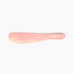 Dinosaur Designs Temple Cake Knife in Blossom — handcrafted marbled pink and cream resin cake knife with smooth tapered blade and rounded handle