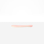 Dinosaur Designs Temple Cake Knife in Blossom — handcrafted marbled pink and cream resin cake knife with smooth tapered blade and rounded handle