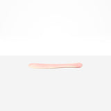 Dinosaur Designs Temple Cake Knife in Blossom — handcrafted marbled pink and cream resin cake knife with smooth tapered blade and rounded handle