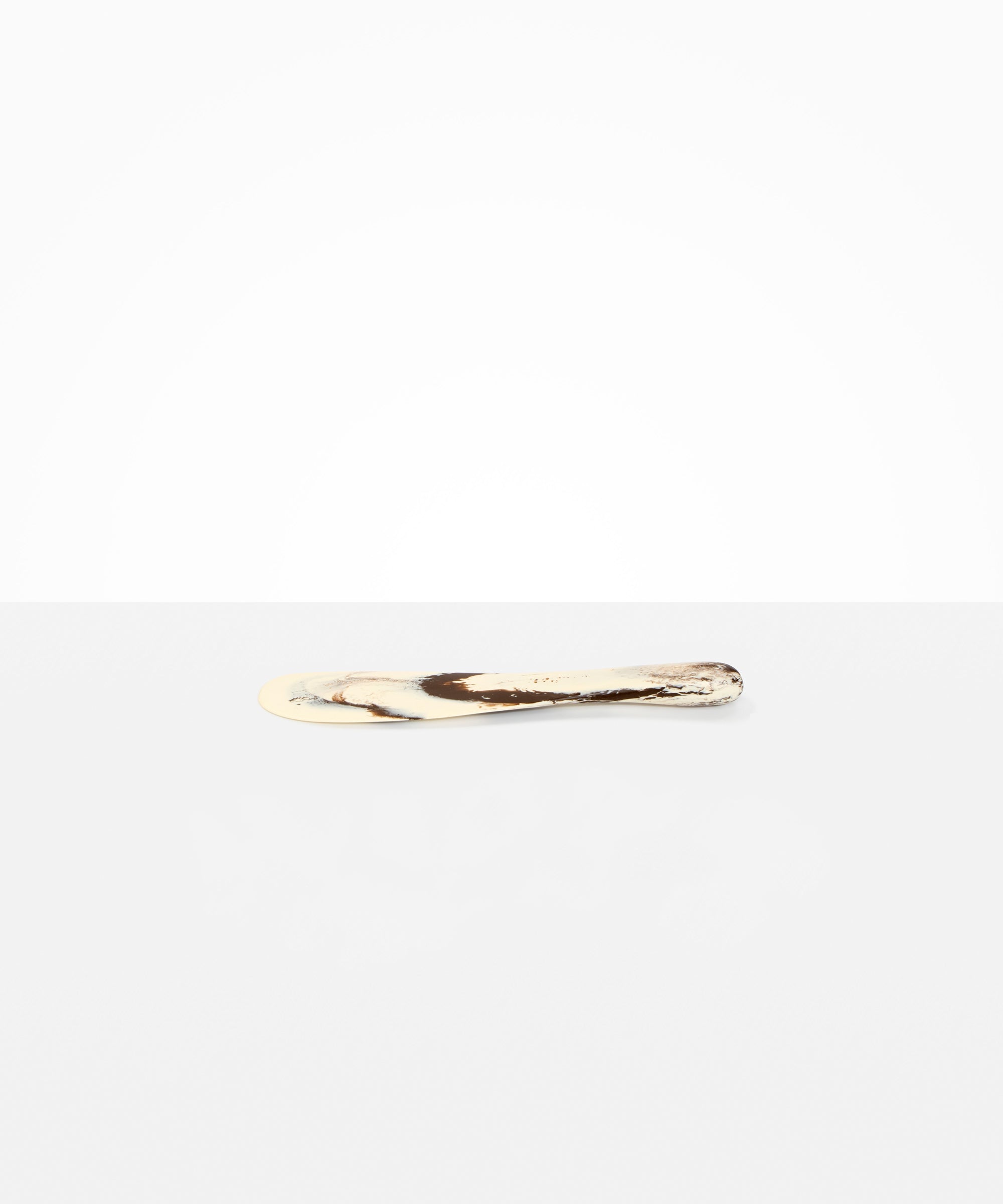 Dinosaur Designs Temple Cake Knife in Cappuccino — handcrafted marbled brown and cream resin cake knife with smooth tapered blade and rounded handle