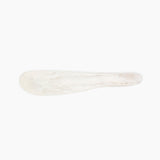 Dinosaur Designs Temple Cake Knife in Chalk Swirl — handcrafted marbled off white resin cake knife with smooth tapered blade and rounded handle