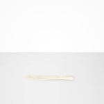 Dinosaur Designs Temple Cake Knife in Chalk Swirl — handcrafted marbled off white resin cake knife with smooth tapered blade and rounded handle