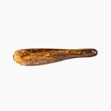 Dinosaur Designs Temple Cake Knife in Dark Horn — handcrafted marbled brown, black and gold resin cake knife with smooth tapered blade and rounded handle