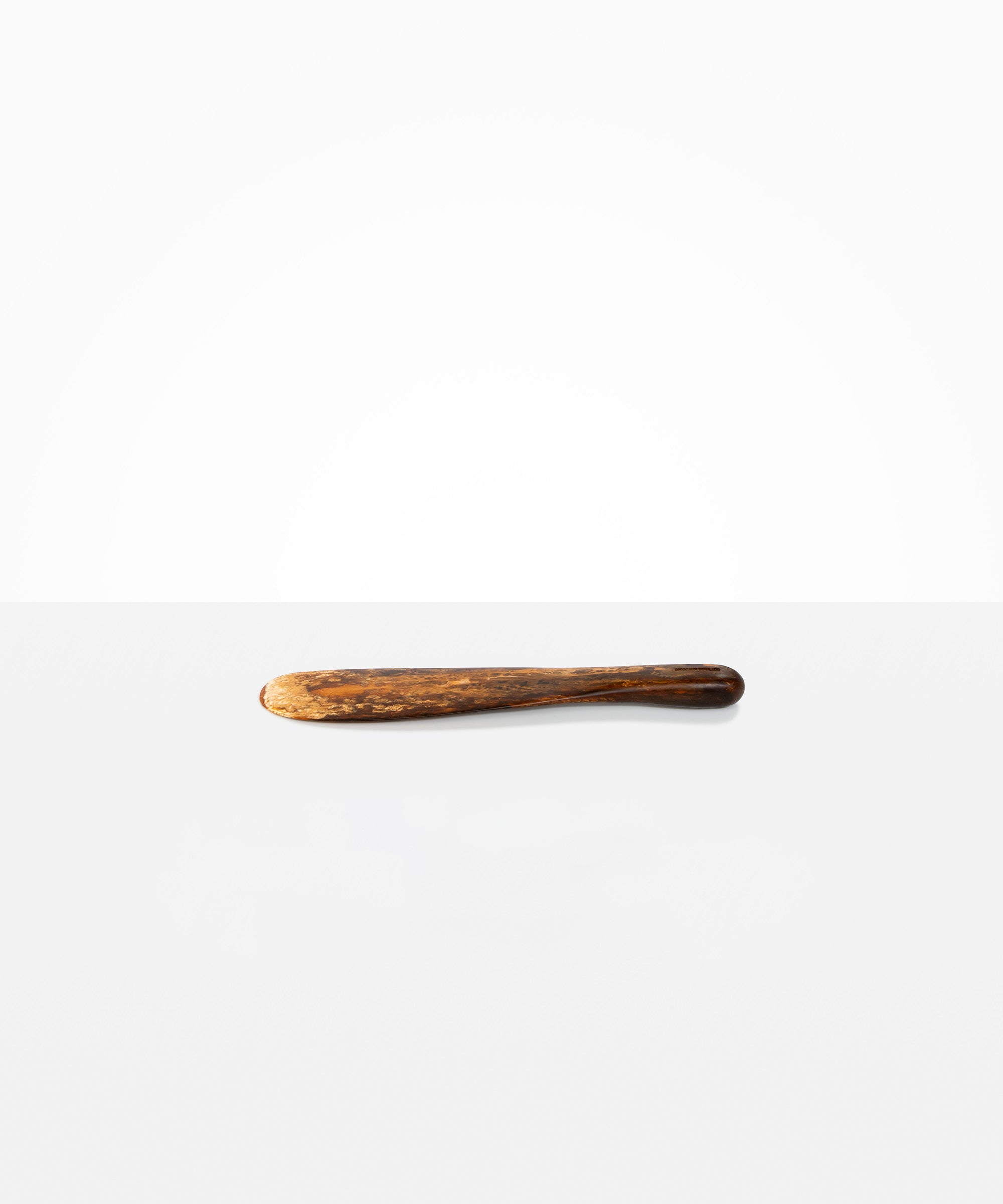 Dinosaur Designs Temple Cake Knife in Dark Horn — handcrafted marbled brown, black and gold resin cake knife with smooth tapered blade and rounded handle