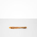 Dinosaur Designs Temple Cake Knife in Light Horn — handcrafted marbled brown, cream and clear resin cake knife with smooth tapered blade and rounded handle