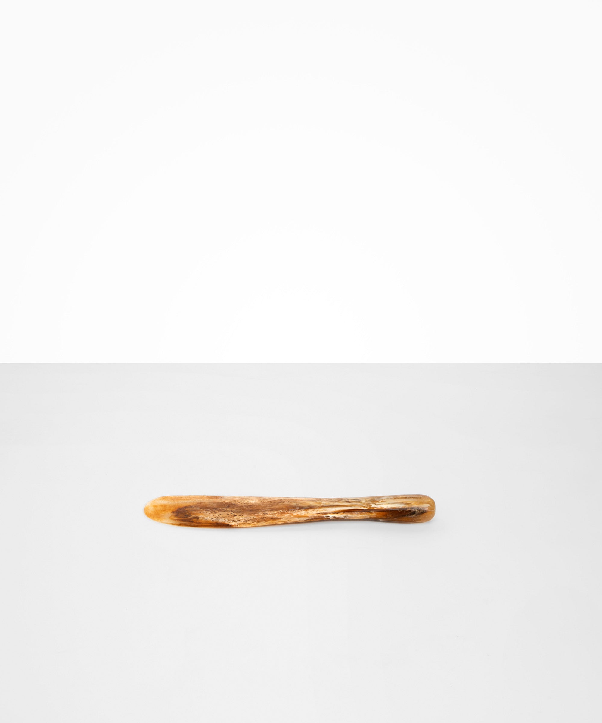 Dinosaur Designs Temple Cake Knife in Light Horn — handcrafted marbled brown, cream and clear resin cake knife with smooth tapered blade and rounded handle