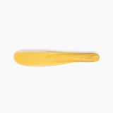 Dinosaur Designs Temple Cake Knife in Pollen — handcrafted marbled yellow and clear resin cake knife with smooth tapered blade and rounded handle