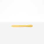 Dinosaur Designs Temple Cake Knife in Pollen — handcrafted marbled yellow and clear resin cake knife with smooth tapered blade and rounded handle