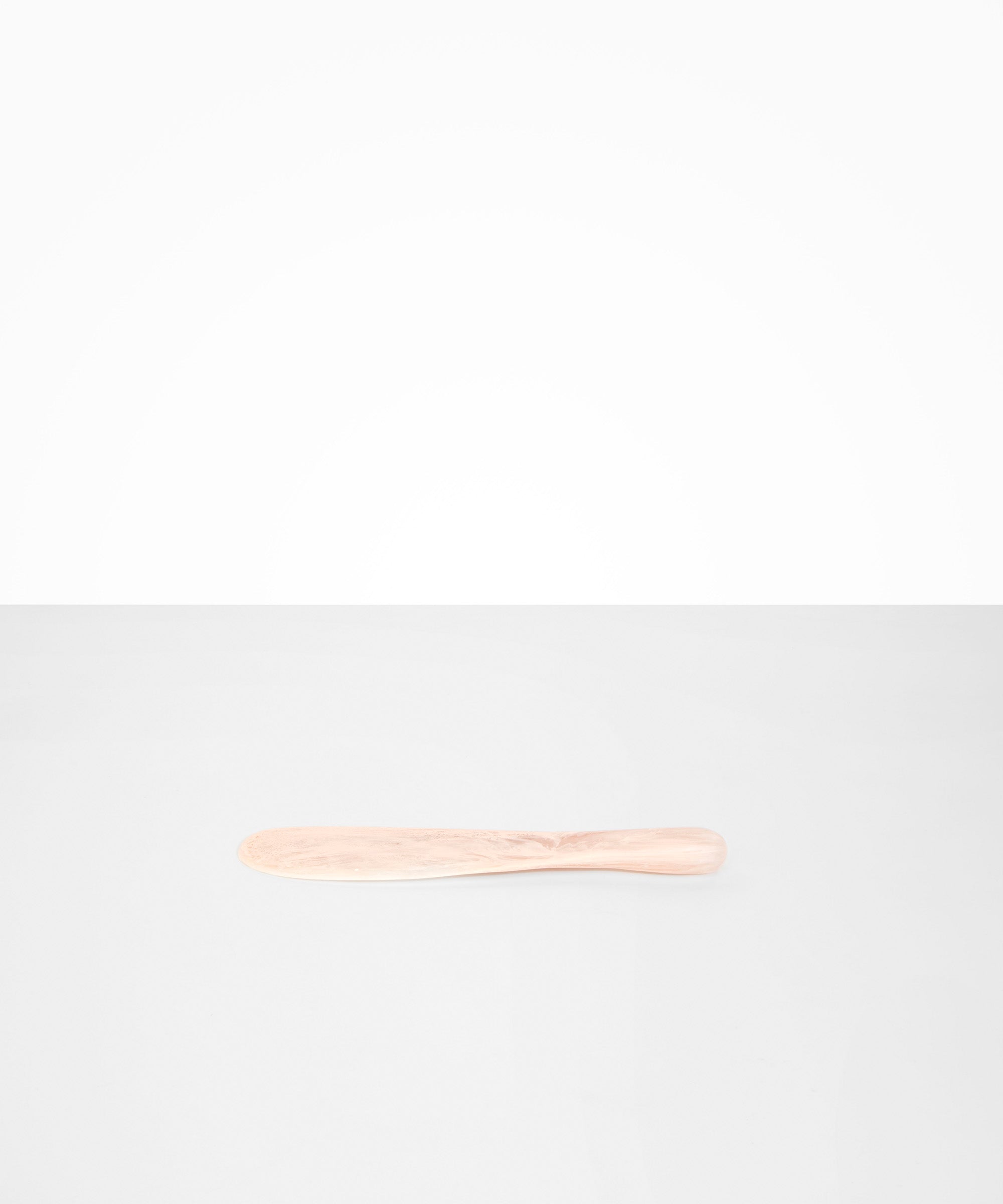 Dinosaur Designs Temple Cake Knife in Rose Swirl — handcrafted marbled dusty pink resin cake knife with smooth tapered blade and rounded handle