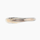Dinosaur Designs Temple Cake Knife in Sandy Pearl — handcrafted marbled beige, grey and pearlescent resin cake knife with smooth tapered blade and rounded handle