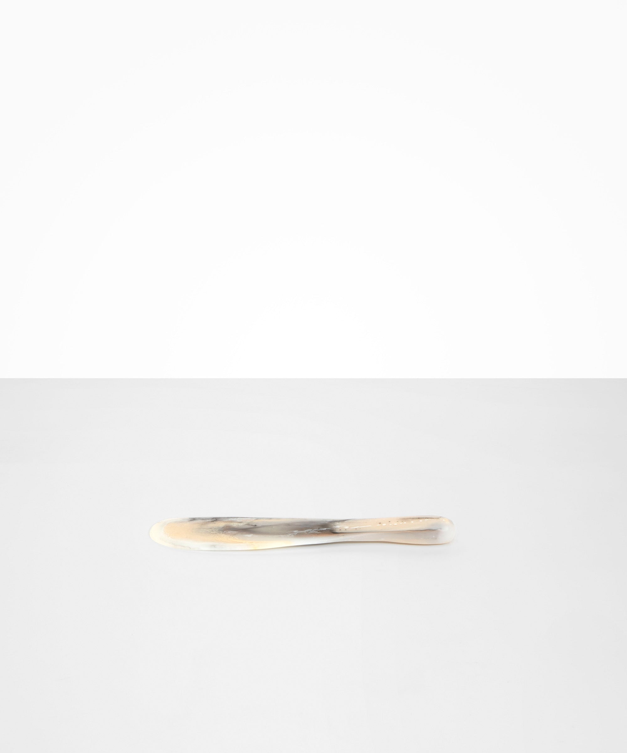 Dinosaur Designs Temple Cake Knife in Sandy Pearl — handcrafted marbled beige, grey and pearlescent resin cake knife with smooth tapered blade and rounded handle