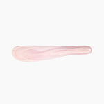 Dinosaur Designs Temple Cake Knife in Shell Pink — handcrafted marbled pale pink resin cake knife with smooth tapered blade and rounded handle