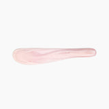 Dinosaur Designs Temple Cake Knife in Shell Pink — handcrafted marbled pale pink resin cake knife with smooth tapered blade and rounded handle