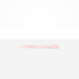 Dinosaur Designs Temple Cake Knife in Shell Pink — handcrafted marbled pale pink resin cake knife with smooth tapered blade and rounded handle