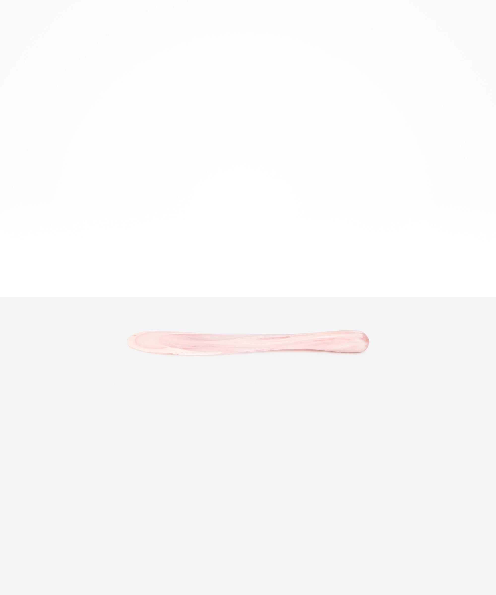 Dinosaur Designs Temple Cake Knife in Shell Pink — handcrafted marbled pale pink resin cake knife with smooth tapered blade and rounded handle